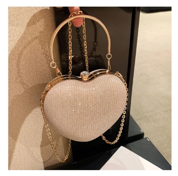Description Type: Heart Shaped Bag Brand: 100% Brand New Style: Fashion, trend, Gender: Women Material: Metal and PU Color: Golden, Pink, Size: 6.69 x 5.91 x 1.97 Inches Quantity: 1 x Heart Shaped Bag Occasion: Casual, Daily, Shopping, Travel/ Wedding/ engagement/ anniversary/party suitable for any season. Casual style with simple solid appearance,fresh and elegant, beautiful appearance, add beauty. Adapts to any outfit. Ideal gift for loved ones Note: The image may be slightly different from the jewelry product due to the camera or your display.